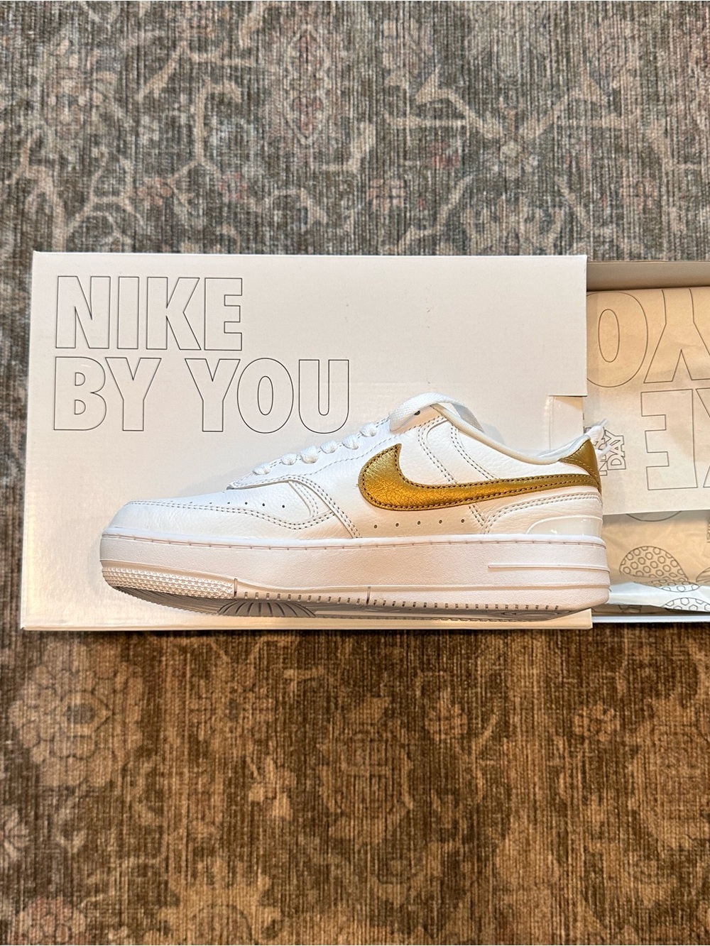 NIKE Air Force 1 Unisex White Sneakers with Gold Swoosh